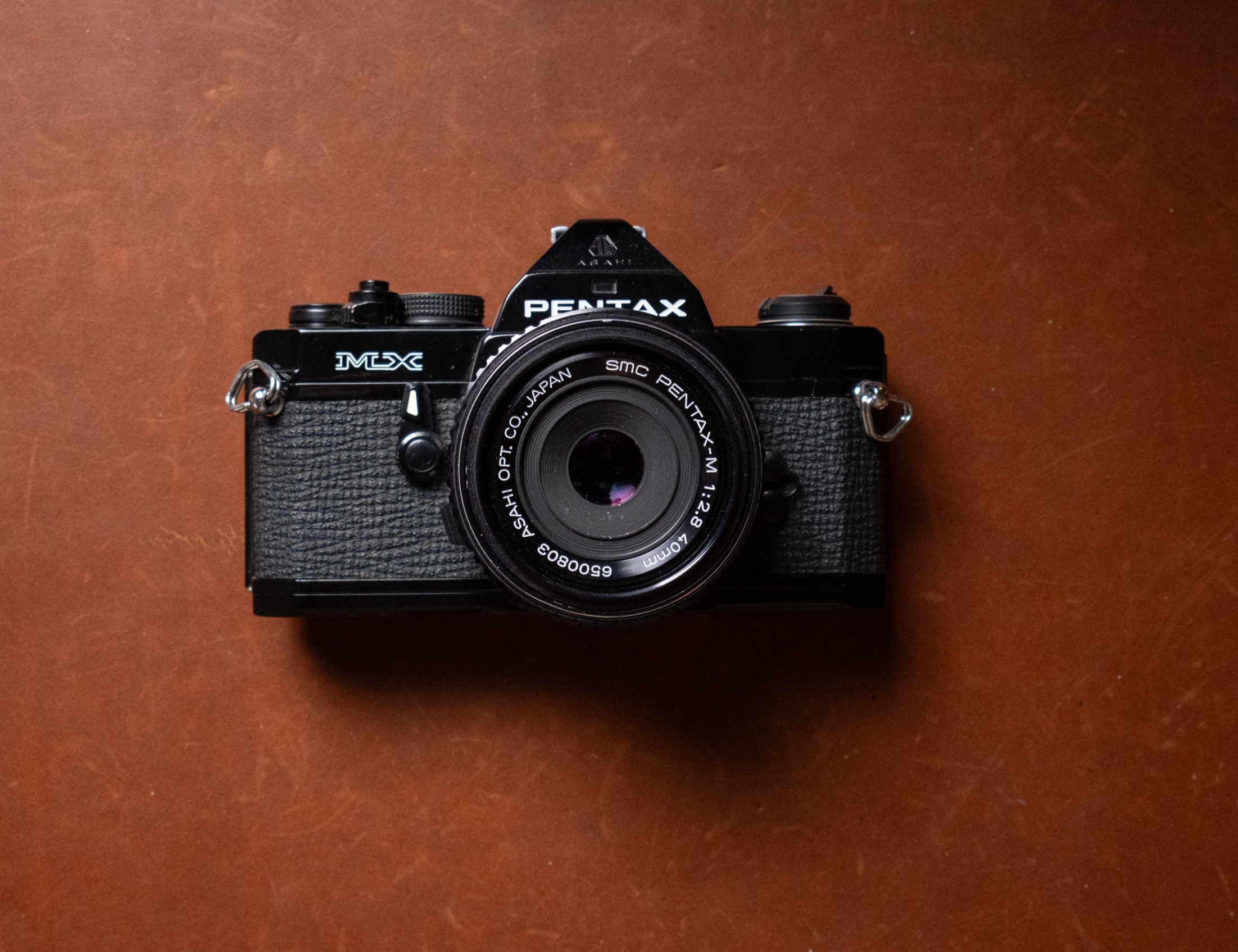 A manual focusing Pentax MX with 40mm 2.8 pancake lens.