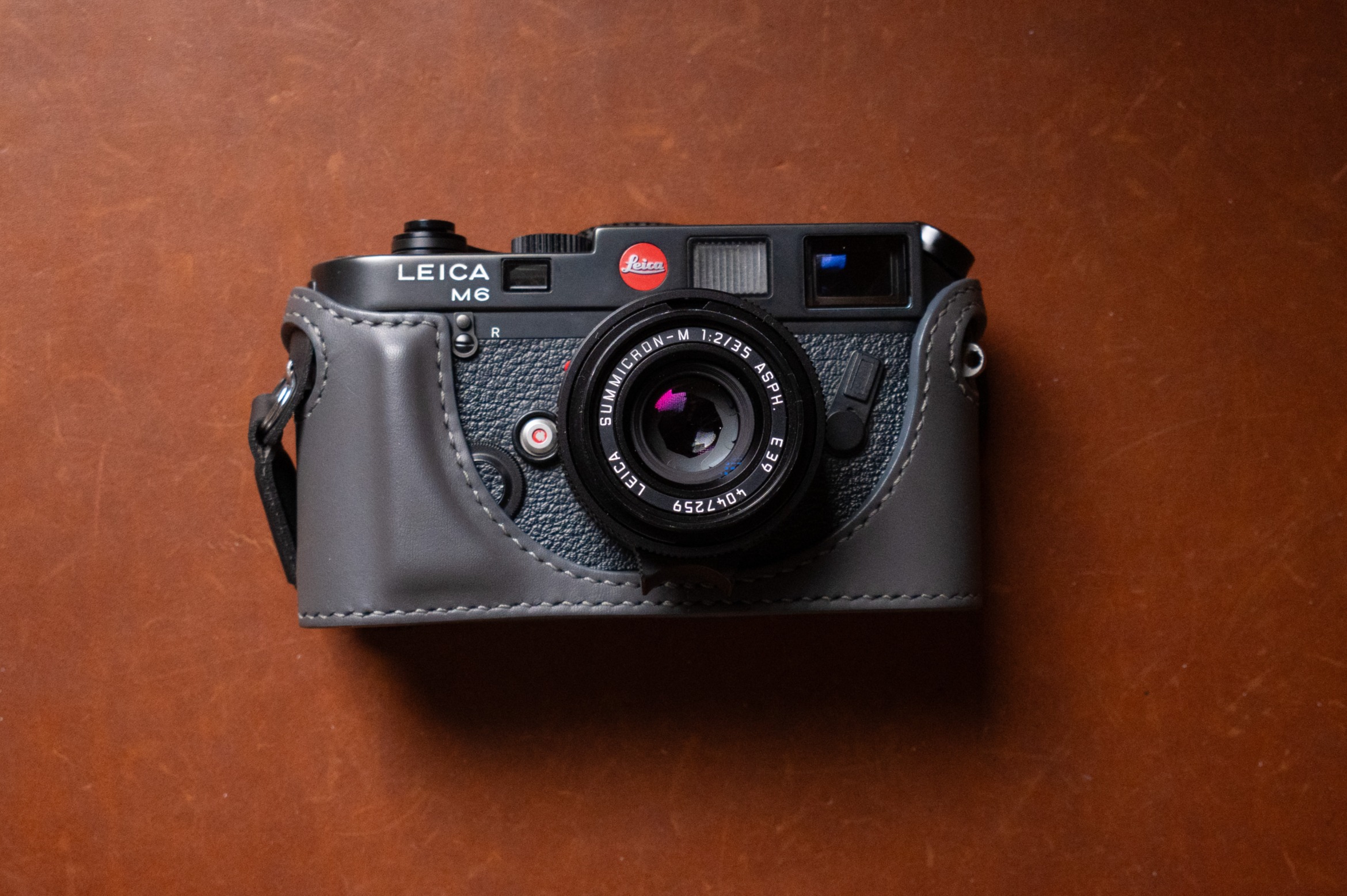 A Leica M6 with lens and half case.