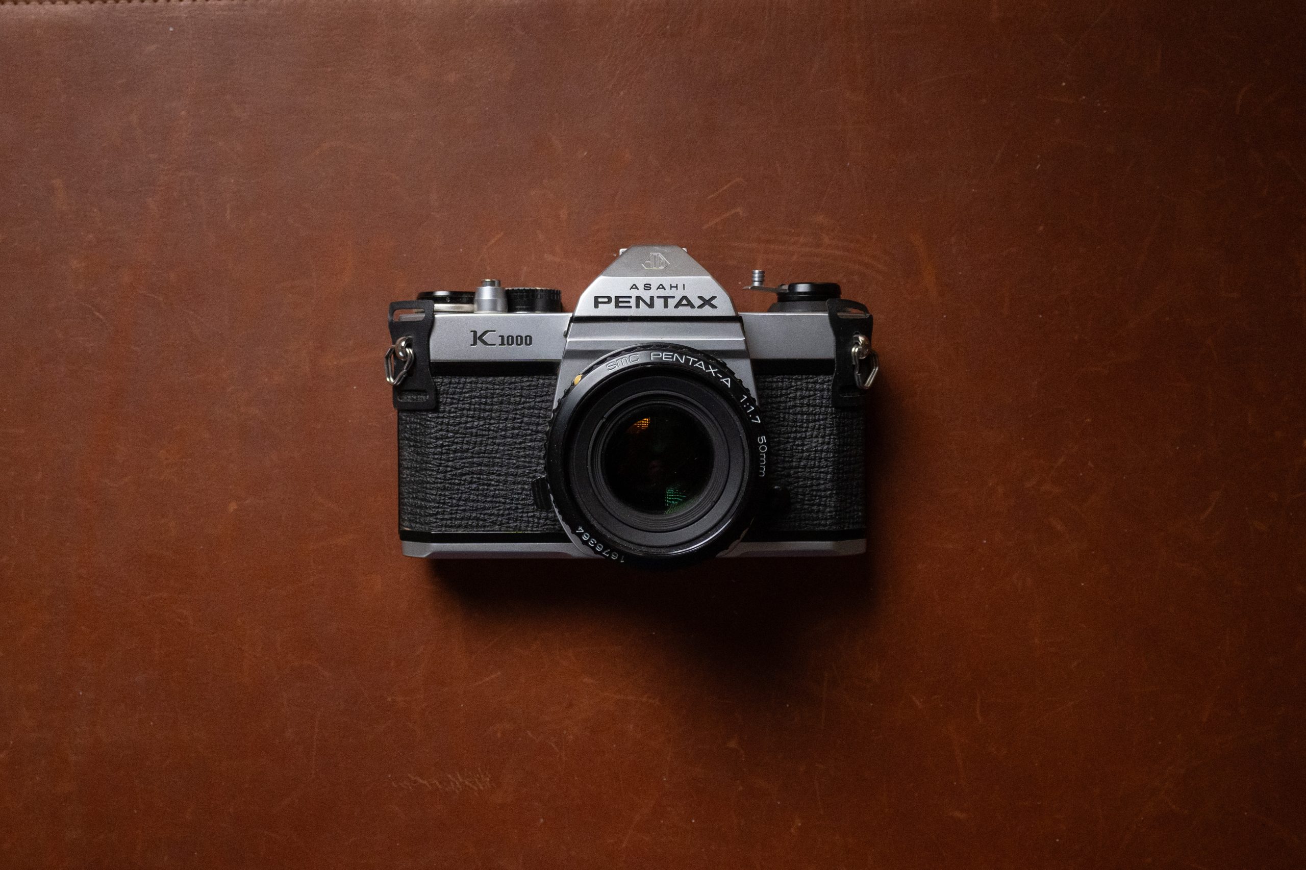 A Pentax K1000 35mm film camera with 50mm 1.7 lens.
